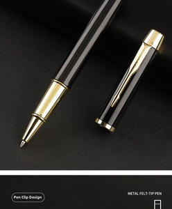 Detailed close-up of a metal felt-tip business pen with gold arrow clip and black finish