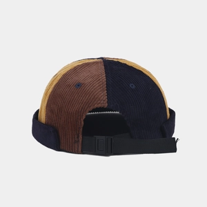 Corduroy docker hat with brown, navy, and ginger color blocking and adjustable back strap