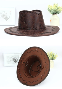 Detail of vintage brown cowboy hat showing distressed cracked texture and stitch work