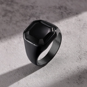 Minimalist black stainless steel square ring with a brushed finish and polished top
