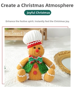 Detailed close-up of a knitted gingerbread man doll wearing a chef hat and green vest