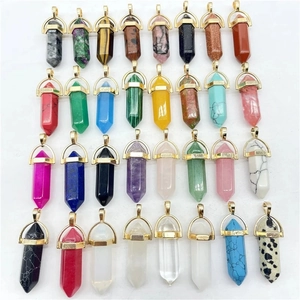 Various hexagonal crystal pendants with gold metal bails shown in a grid layout