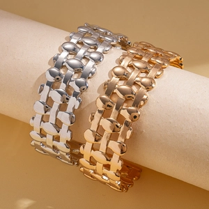 Three-layer hollow oval cuff bracelet set in gold and silver finish with woven texture