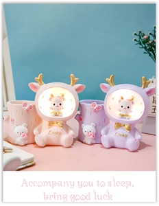Macro detail of cute rabbit pencil holder with lucky star light for desk decoration
