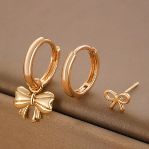 Three-piece gold bow pendant earrings set with polished finish for women fashion