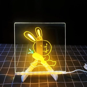 Luminous acrylic drawing board featuring a warm yellow rabbit design on a white tripod