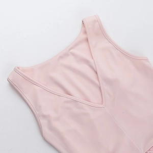 Close-up of V-neck stitching and premium pink fabric detail on this sleeveless dress