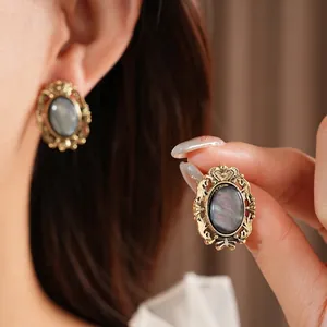 Vintage resin oval earrings in gold hollow baroque setting with rainbow gray stones