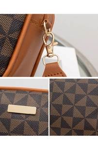 Macro detail of geometric print leather surface and gold metal buckle on camera bag