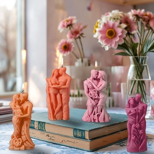 Macro detail of couple embrace candle mold with intricate rose texture on the base