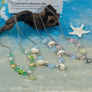 Detailed beach-themed shell necklaces with colorful beads and starfish charms