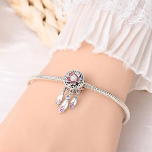 Bohemian dreamcatcher charm bracelet with purple feathers and pink flower detail