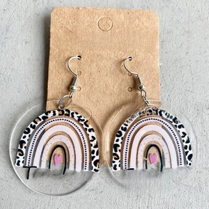 Detail of acrylic rainbow earrings with Teacher lettering on a fashion jewelry card