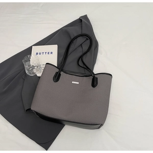 Chic autumn grey fabric tote bag with black leather trim and metal logo detailing