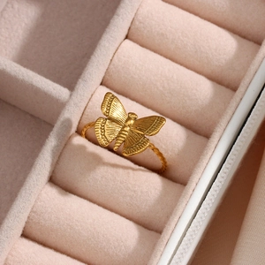 18K gold plated butterfly open ring with twisted band design in a pink jewelry box