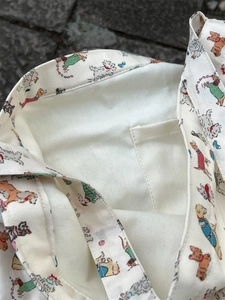 Detail shot of the inner pocket and cute cartoon dog prints on a canvas tote bag