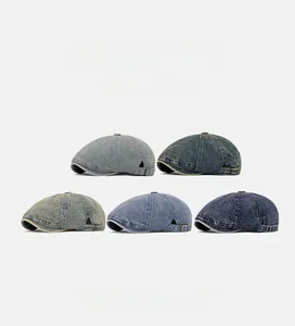 Collection of retro denim newsboy caps in various washes with adjustable metal side buckles