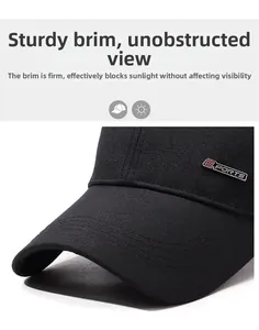 Detail of black baseball cap showing 'SPORTS' metal logo and sturdy curved brim structure