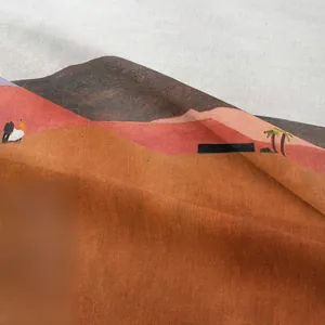 Detailed view of bohemian tapestry fabric showing desert mountain landscape and soft texture