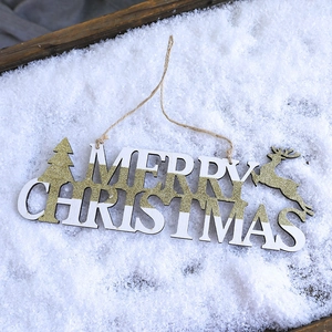 Detailed view of Merry Christmas wooden sign with gold glitter reindeer and tree patterns