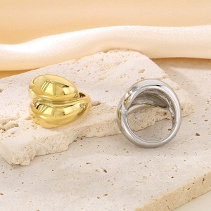 Exaggerated chunky stainless steel heart rings in gold and silver finish on stone