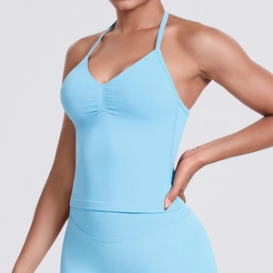 Detail of light blue high-impact halter neck sports bra with ruched chest design