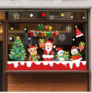 Detailed Christmas window decals showing Santa, reindeer and snowflake scene on glass