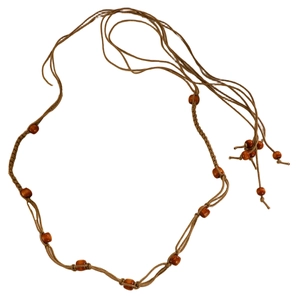 Detailed view of handmade brown woven waist chain with dark wooden beads and texture