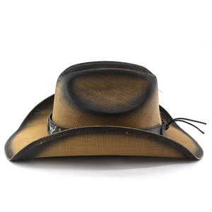 Detail of western straw cowboy hat with leather band and turquoise bull head buckle
