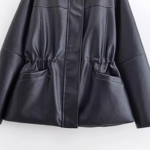 Women's black faux leather jacket featuring a waist drawstring and textured finish