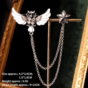 Silver owl and star collar brooch with tassels and rhinestones on emerald velvet