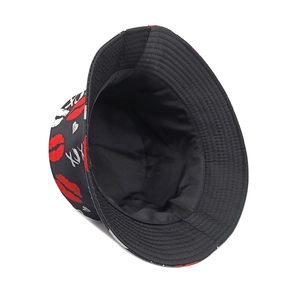 Black bucket hat featuring red lip prints and white XOXO graffiti for sun protection