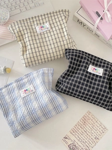 Three-color plaid makeup bags in beige, blue and black with embroidered patch detail