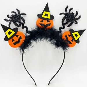 Macro view of Halloween headband with orange felt pumpkins, witch hats, and black spiders