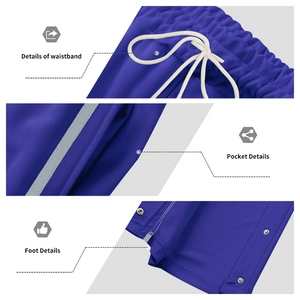 Blue heavy casual sweatpants with drawstring waist, side pockets and snap button hems