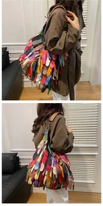 Detail of colorful tiered leather fringe on a Bohemian style crossbody tote bag