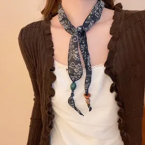 Vintage floral silk skinny scarf with dark blue paisley pattern and wooden beads