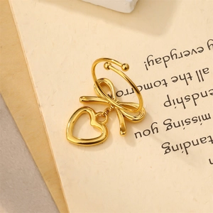 Elegant gold stainless steel open ring featuring a bow knot and hollow heart pendant