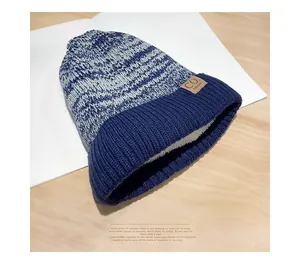 Close-up of thick sherpa lining and mixed blue knit texture on this warm winter hat