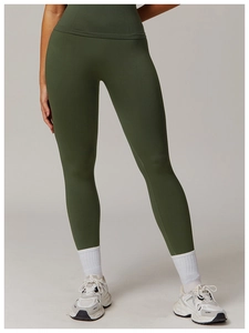 Detail of high-waist olive green yoga leggings showing seamless knit texture and compression