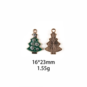 Detail of Christmas tree pendant with green enamel and rhinestones 16x23mm