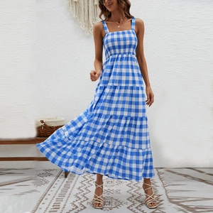 Detail of blue and white checkered summer dress featuring shirred bodice and layered skirt