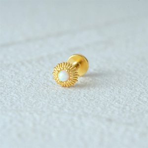 Macro detail of gold opal sunflower labret stud with flat back internal threading