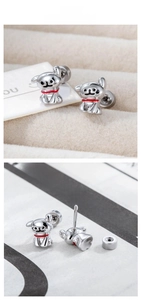 Detailed view of dog stud earring with red enamel collar and screw back closure