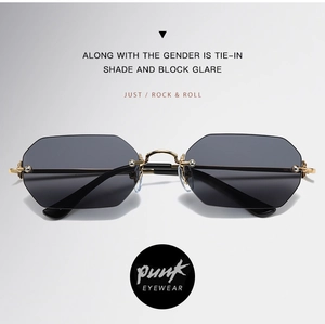 Detalle de gafas de sol punk octogonales sin montura con marco dorado y lentes grises