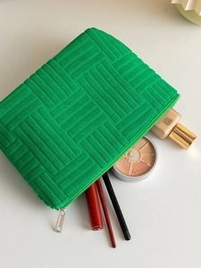 Portable bright green textured towel fabric makeup bag for travel storage and cosmetics