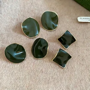 Three-pair set of geometric 14k gold plated stud earrings with dark green enamel finish