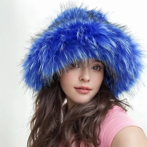 Close-up of bright blue faux fur hat with thick long plush texture for winter warmth