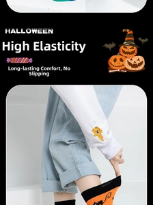 Detail of high-elasticity orange and black Halloween socks with cat pattern and wide ribbing