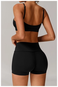 Rear view of black seamless high waist sports shorts and racerback bra set